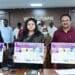 District Collector Chadalavada Nagarani unveiling the Financial Literacy Week 2026 awareness wall poster at the District Collectorate conference hall with officials present.