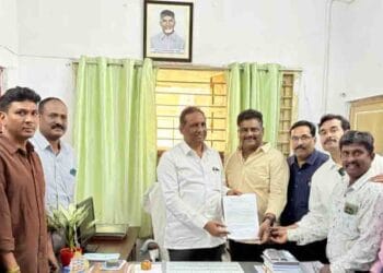 Journalist union leaders submit a representation to I&PR Deputy Director K. Sada Rao at his Visakhapatnam office regarding press accreditation verification.