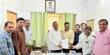 Journalist union leaders submit a representation to I&PR Deputy Director K. Sada Rao at his Visakhapatnam office regarding press accreditation verification.