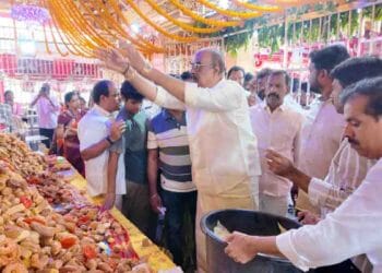 MLA Bolisetti Srinivas announcing Balusulamma Annadanam Trust at Tadepalligudem temple event