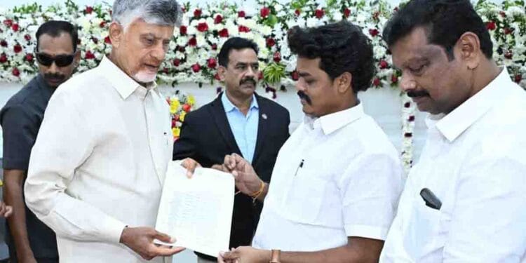 CM Chandrababu Naidu handing over cheque for Polavaram displaced families in Mangalagiri