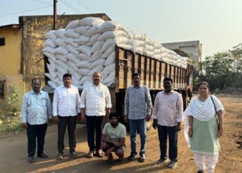 Officials inspecting seized ration rice bags during Eluru ration rice seizure on NH-16
