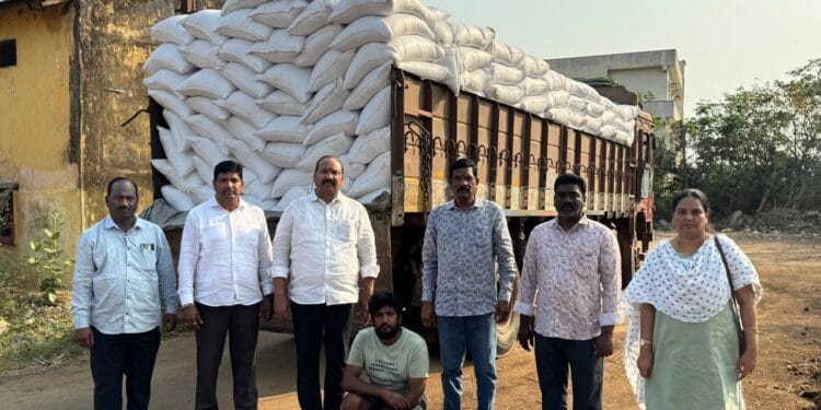 Officials inspecting seized ration rice bags during Eluru ration rice seizure on NH-16