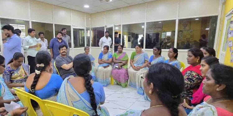 Gudivada MLA Venigandla Ramu interacting with Anganwadi workers during a meeting at Praja Vedika office in Gudivada