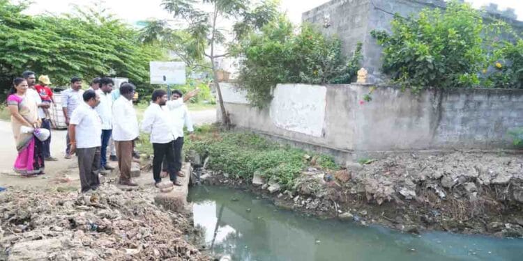 TDP leaders inspecting drainage issues in Ravindra Nagar Nellore Rural