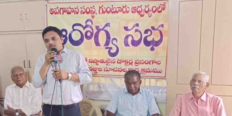 Doctor explaining liver and digestive health awareness at a medical seminar