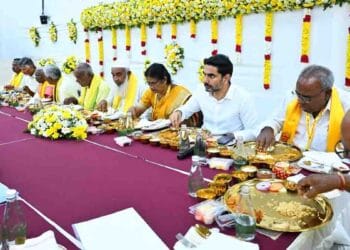 Nara Lokesh interacting with TDP party workers during foundation day event