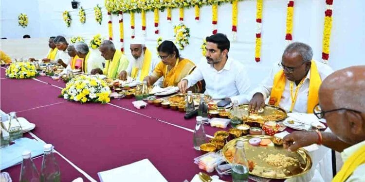 Nara Lokesh interacting with TDP party workers during foundation day event