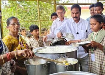 MLA Sriram Rajagopal interacting with students during school inspection in Jaggayyapeta