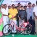 Minister Nimmala Ramanaidu distributing bicycles to students in Palakollu