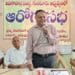 Dentist explaining modern dental treatments and oral hygiene tips to audience in Guntur