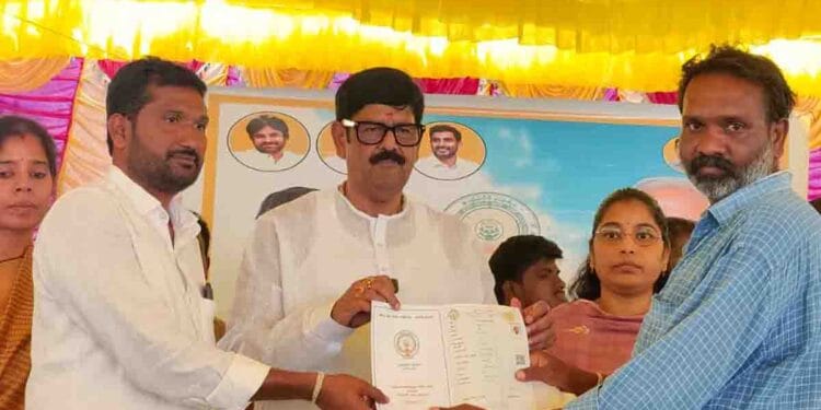 Minister Anam Ramanarayana Reddy distributing new Pattadar Passbooks with government seal and QR code to farmers in Yanamadala village of Chejerla mandal.