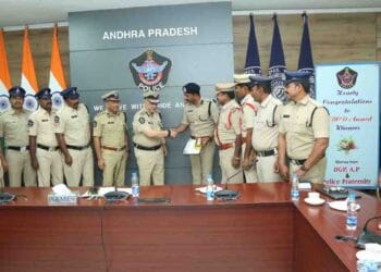 Prakasam SP V Harshavardhan Raju receiving ABCD Award for Best Crime Detection from DGP Harish Kumar Gupta
