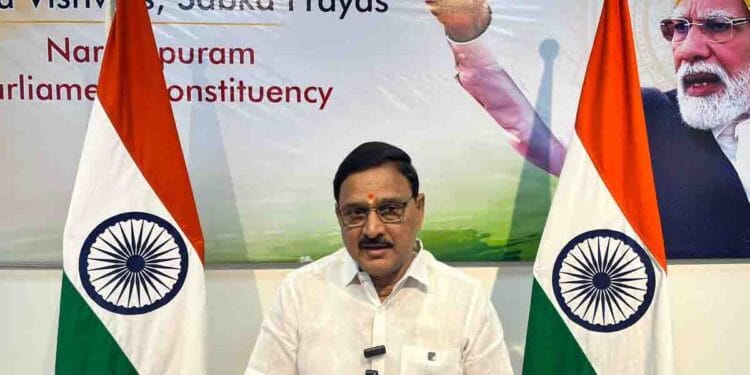 Union Minister Bhupathiraju Srinivasa Varma announcing the ArcelorMittal Nippon Steel Plant Bhoomi Puja at Rajayyapeta in Anakapalli district.