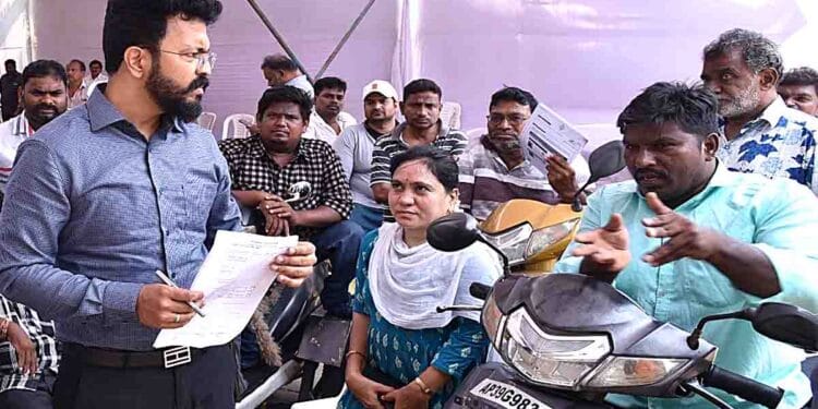 Guntur Collector Sai Kanth Varma meeting persons with disabilities at PGRS event
