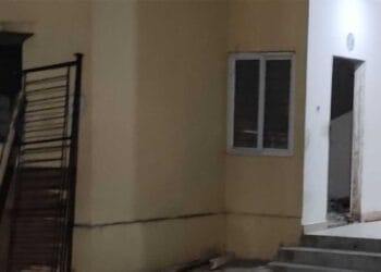 Damaged walls and unauthorized construction activity in TIDCO housing complex